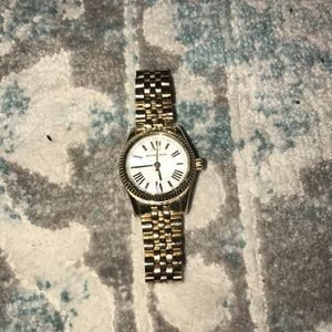Small gold Michael kors watch with white face